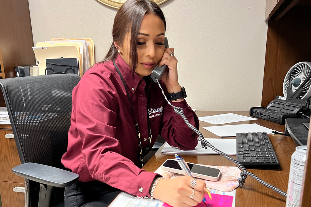 Sharyland Water Supply Corporation employee providing customer support over the phone